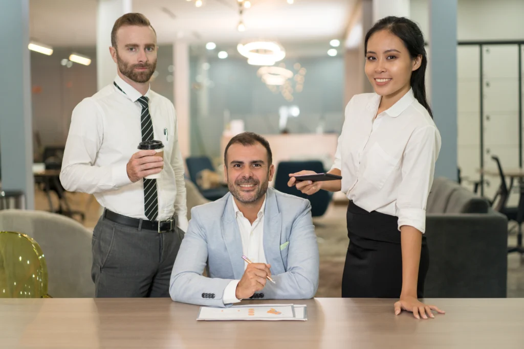 business people working posing desk office